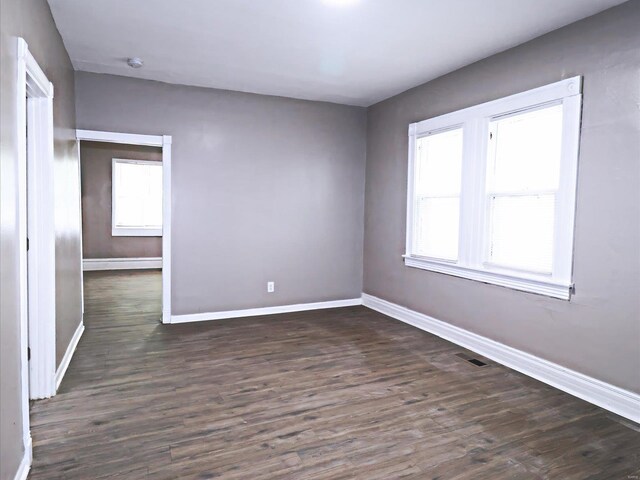 empty room with hardwood / wood-style flooring