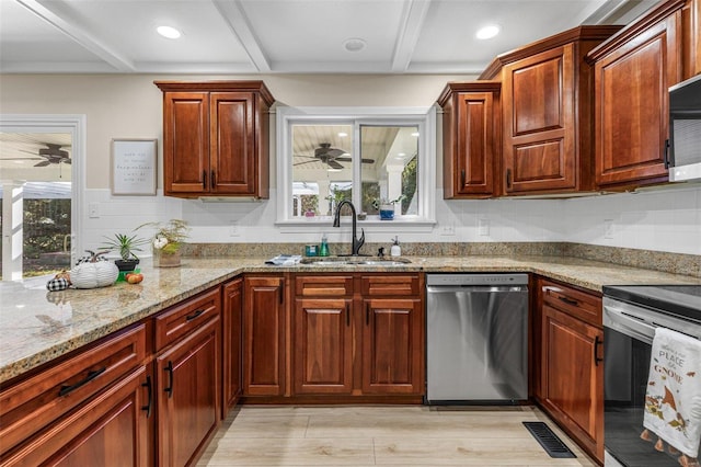 kitchen featuring beam ceiling, stainless steel appliances, visible vents, a sink, and light stone countertops