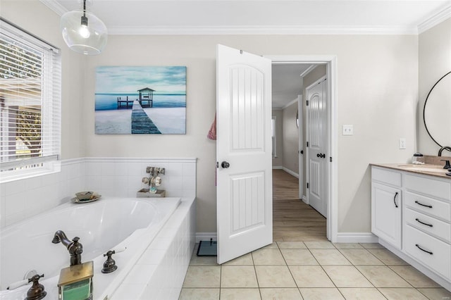 full bath with tile patterned flooring, crown molding, vanity, and a bath