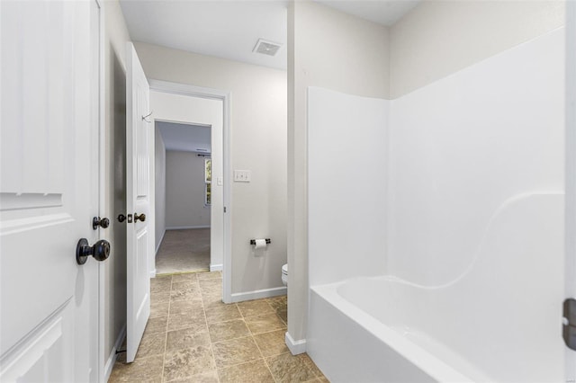 bathroom with toilet, baseboards, and visible vents