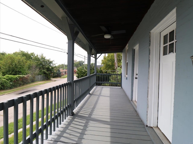 wooden terrace with ceiling fan