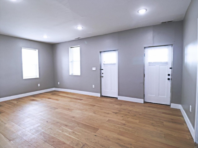 entrance foyer featuring a wealth of natural light and light wood-type flooring