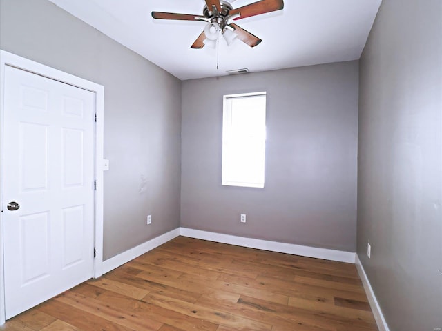 spare room featuring ceiling fan and wood-type flooring