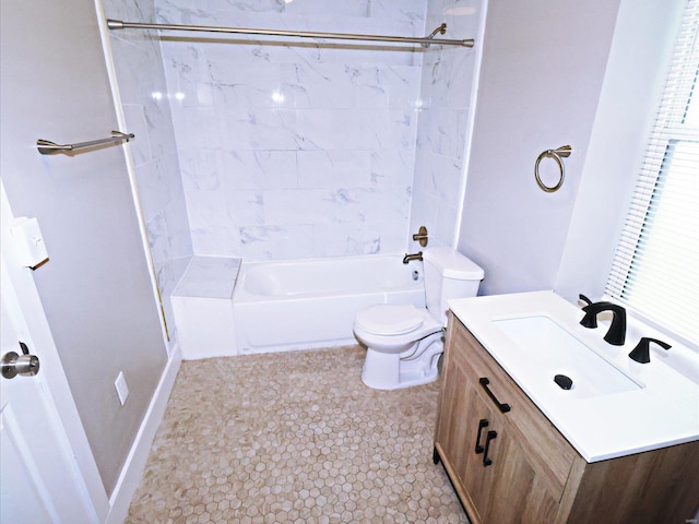 full bathroom with tile patterned flooring, tiled shower / bath, toilet, and vanity