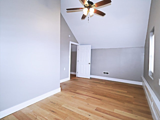 additional living space with ceiling fan, high vaulted ceiling, and light hardwood / wood-style flooring