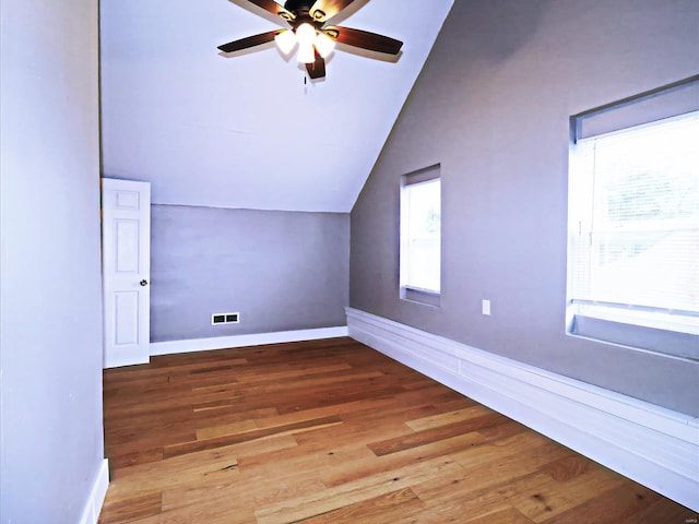 additional living space featuring ceiling fan, lofted ceiling, and hardwood / wood-style floors