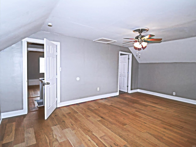 additional living space with hardwood / wood-style flooring, lofted ceiling, and ceiling fan