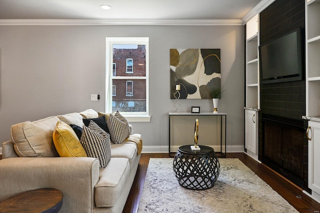 living room with dark hardwood / wood-style floors and crown molding