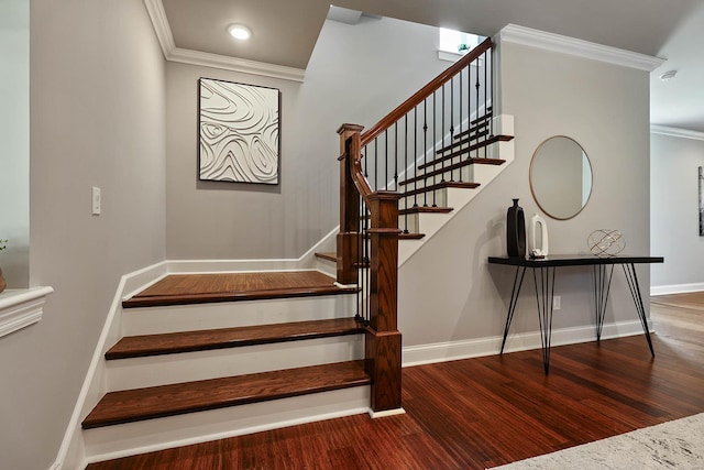 stairs featuring crown molding and hardwood / wood-style floors