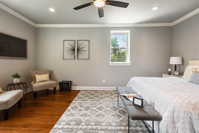 bedroom featuring ceiling fan, dark hardwood / wood-style flooring, and crown molding