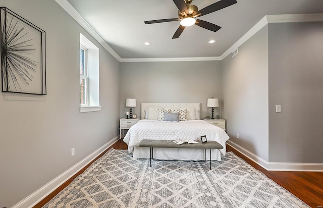 bedroom with ceiling fan, wood-type flooring, and crown molding