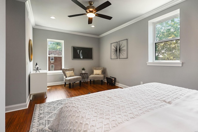 bedroom with crown molding, dark wood-type flooring, and ceiling fan