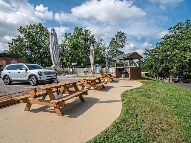 view of home's community featuring a gazebo, a yard, and fence