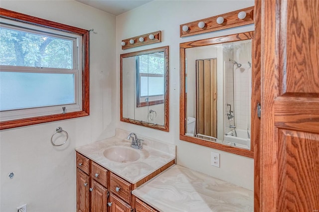 full bathroom with plenty of natural light, toilet, shower / tub combination, and vanity