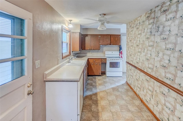 kitchen with backsplash, sink, white electric stove, light tile patterned floors, and ceiling fan