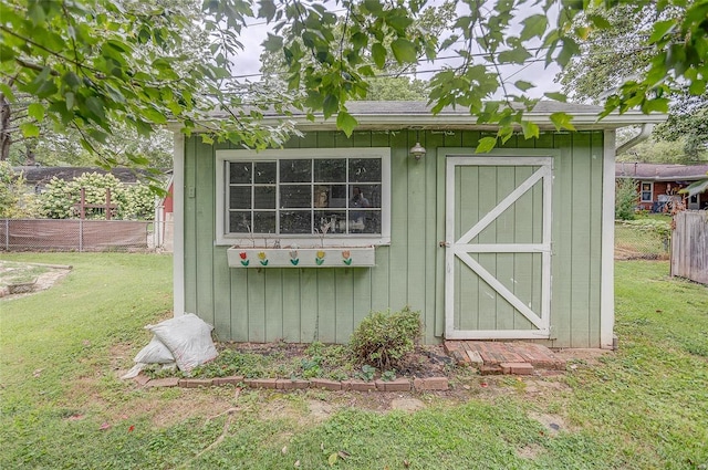 view of outdoor structure with a yard