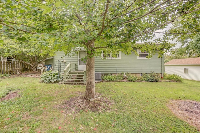 back of house featuring a lawn