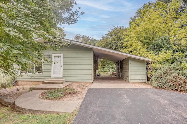 exterior space featuring a carport