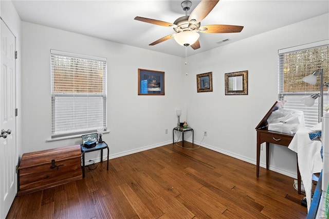 misc room featuring visible vents, ceiling fan, baseboards, and hardwood / wood-style flooring