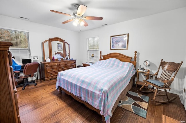 bedroom with visible vents, ceiling fan, and light wood finished floors