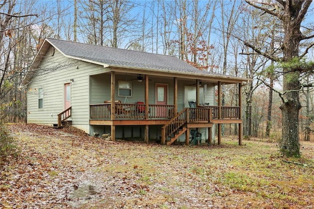 view of front of property with covered porch, roof with shingles, stairs, and a ceiling fan