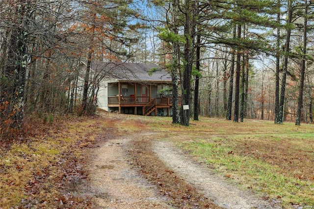 view of front of house with stairs and driveway