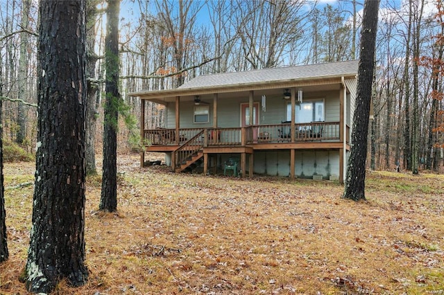 view of front of house with a porch, ceiling fan, and stairway