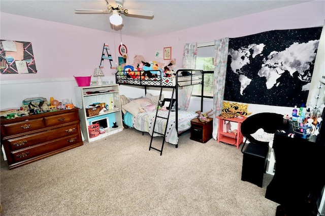 bedroom featuring light colored carpet and ceiling fan