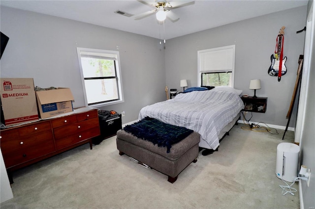 carpeted bedroom with ceiling fan