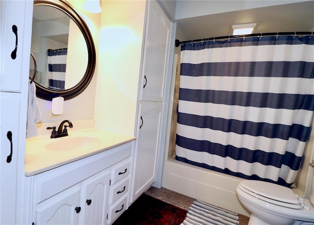 full bathroom featuring tile patterned flooring, shower / tub combo with curtain, toilet, and vanity