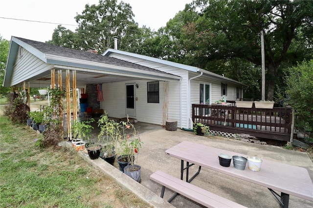 rear view of property with a deck