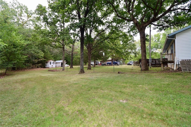 view of yard with a wooden deck