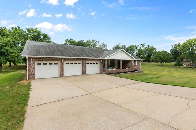 view of front facade with brick siding, a porch, concrete driveway, a garage, and a front lawn