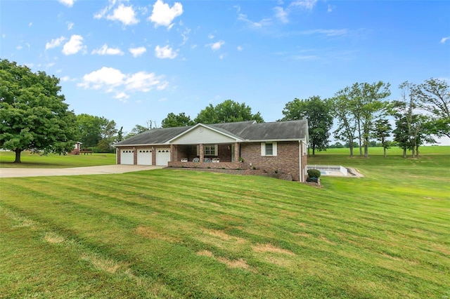 single story home featuring a garage, brick siding, driveway, and a front lawn