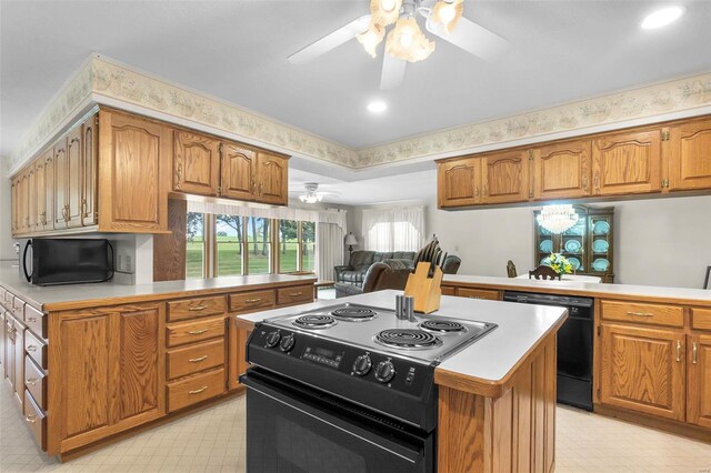 kitchen featuring ceiling fan, black appliances, kitchen peninsula, and light tile patterned floors