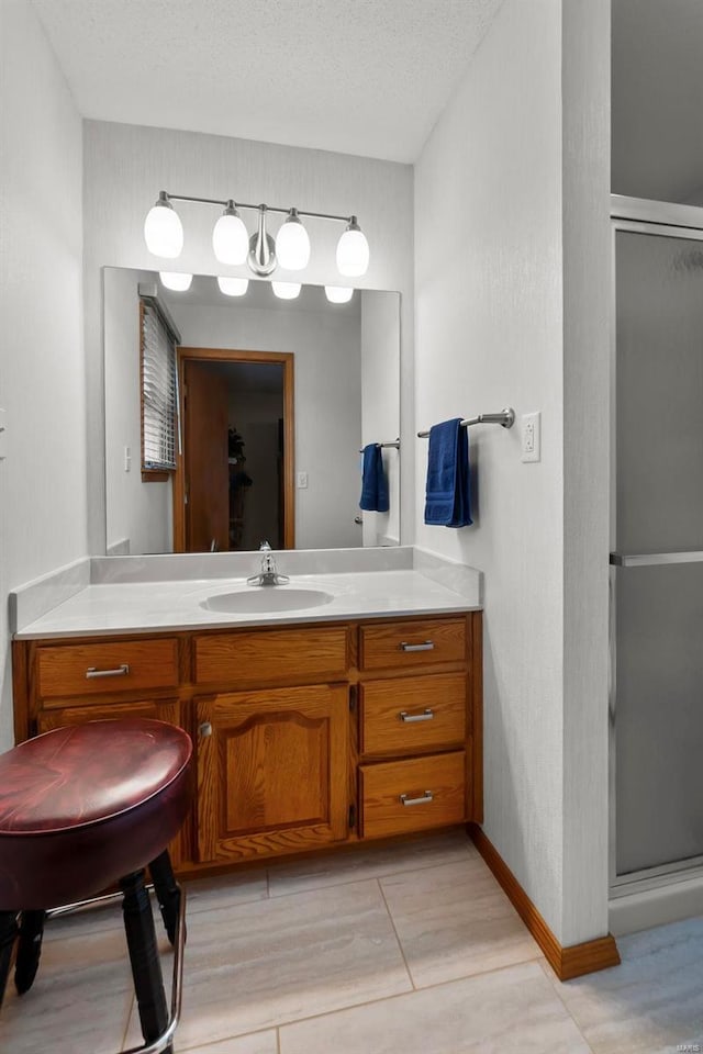 bathroom featuring an enclosed shower, vanity, and hardwood / wood-style flooring