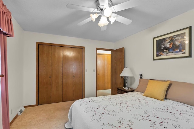 carpeted bedroom with a closet and ceiling fan