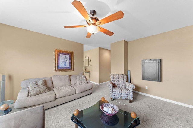 carpeted living room featuring ceiling fan