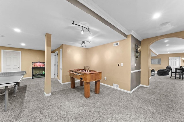 recreation room featuring rail lighting and carpet floors