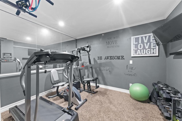 exercise room with ornamental molding