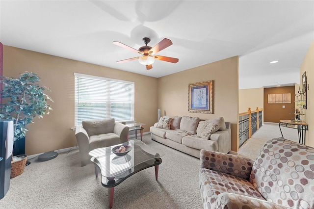 living room featuring light carpet and ceiling fan