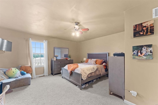 bedroom with ceiling fan and carpet floors