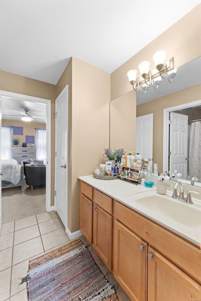 bathroom with tile patterned floors, ceiling fan, and vanity