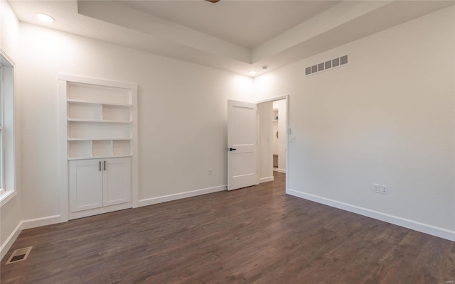 spare room featuring dark hardwood / wood-style floors