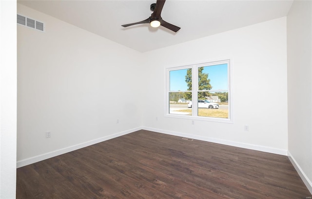 empty room with dark wood-type flooring and ceiling fan