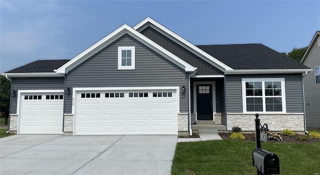 craftsman inspired home with a garage and a front yard