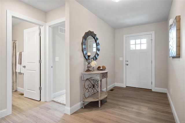 entryway with light hardwood / wood-style flooring