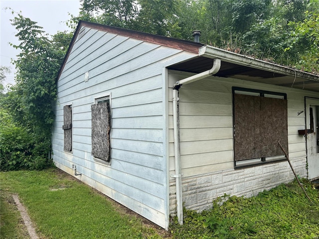 view of property exterior featuring a lawn