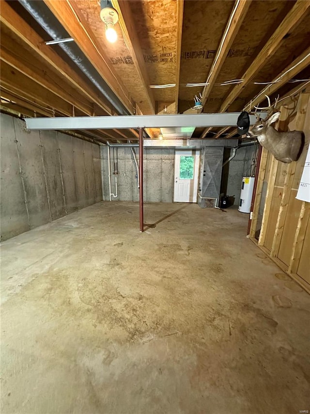 basement featuring electric water heater