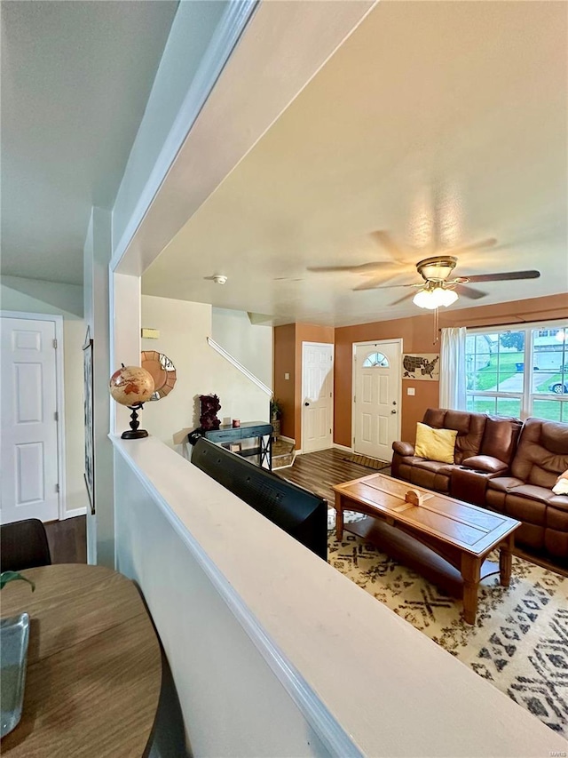 interior space featuring hardwood / wood-style floors and ceiling fan